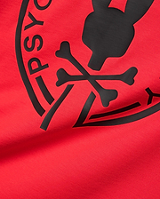 Mens Santa Fe Bunny Graphic Tee, a vibrant red jersey t-shirt featuring a large, central black rubberized Psycho Bunny skull and crossbones graphic with PSYCHO BUNNY text. (6)