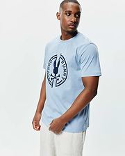 Mens Santa Fe Bunny Graphic Tee, a light blue classic fit jersey t-shirt with a large dark blue circular Psycho Bunny skull logo graphic on the chest and a small woven hem tag. (2)