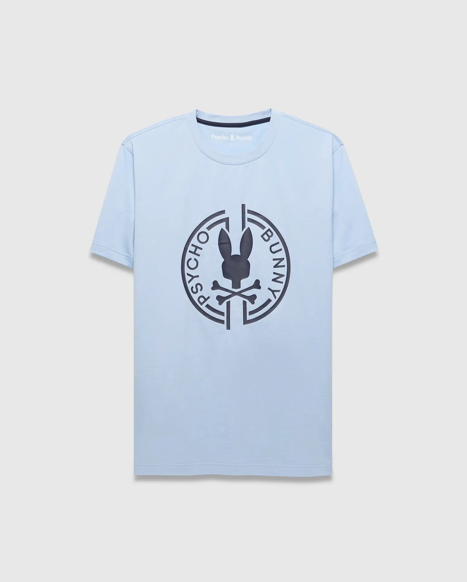 Mens Santa Fe Bunny Graphic Tee. Light blue jersey t-shirt with a classic fit, featuring a large dark grey circular chest graphic of the iconic Psycho Bunny skull logo and brand name. (1)