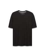 Black Mens Garry Relaxed Fit Tee featuring a subtle all-over embossed Psycho Bunny skull and crossbones pattern, textured jersey fabric, and white inner neckline trim.