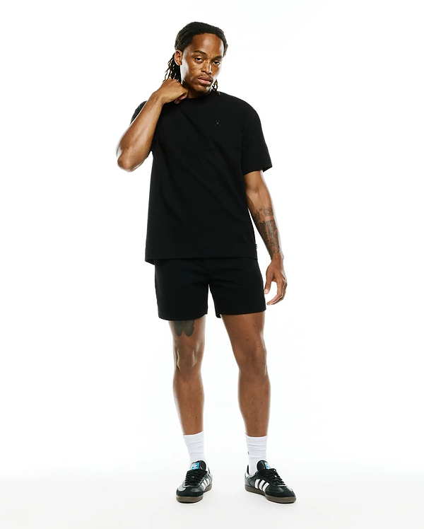 Black Mens Arlen Relaxed Seersucker Tee, a premium streetwear staple, featuring a subtle, tonal embroidered Psycho Bunny skull logo on the left chest, embodying refined style.