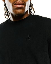 Mens Arlen Relaxed Seersucker Tee, black, featuring a textured seersucker fabric and a small, tonal embroidered Psycho Bunny skull logo on the left chest.