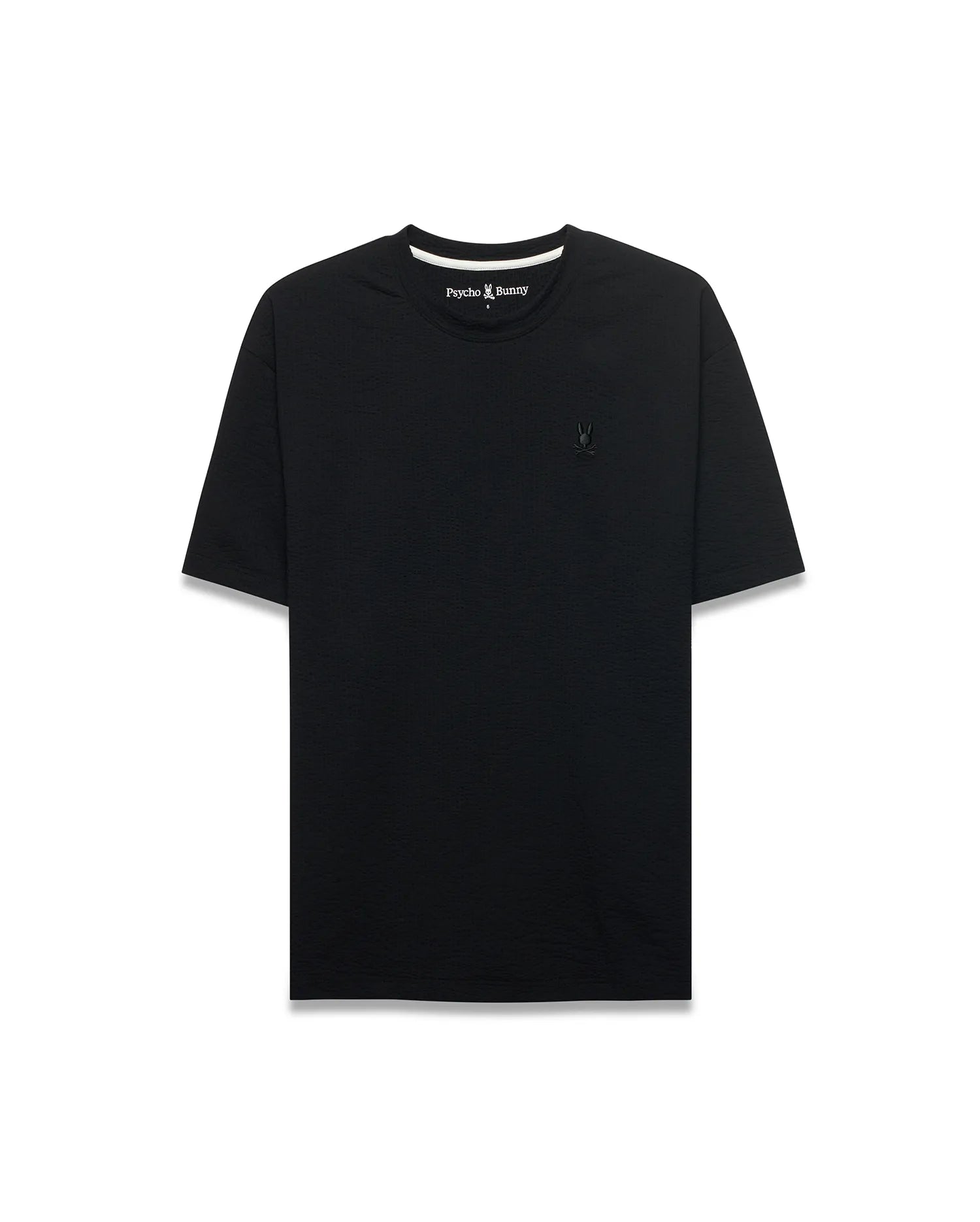 Black Mens Arlen Relaxed Seersucker Tee with subtle texture, featuring a small embroidered black Psycho Bunny skull logo on the left chest and white inner neckline trim.