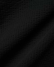 Mens Arlen Relaxed Seersucker Tee, a premium black tee crafted from a distinctive puckered seersucker fabric, offering a relaxed fit and refined streetwear aesthetic.