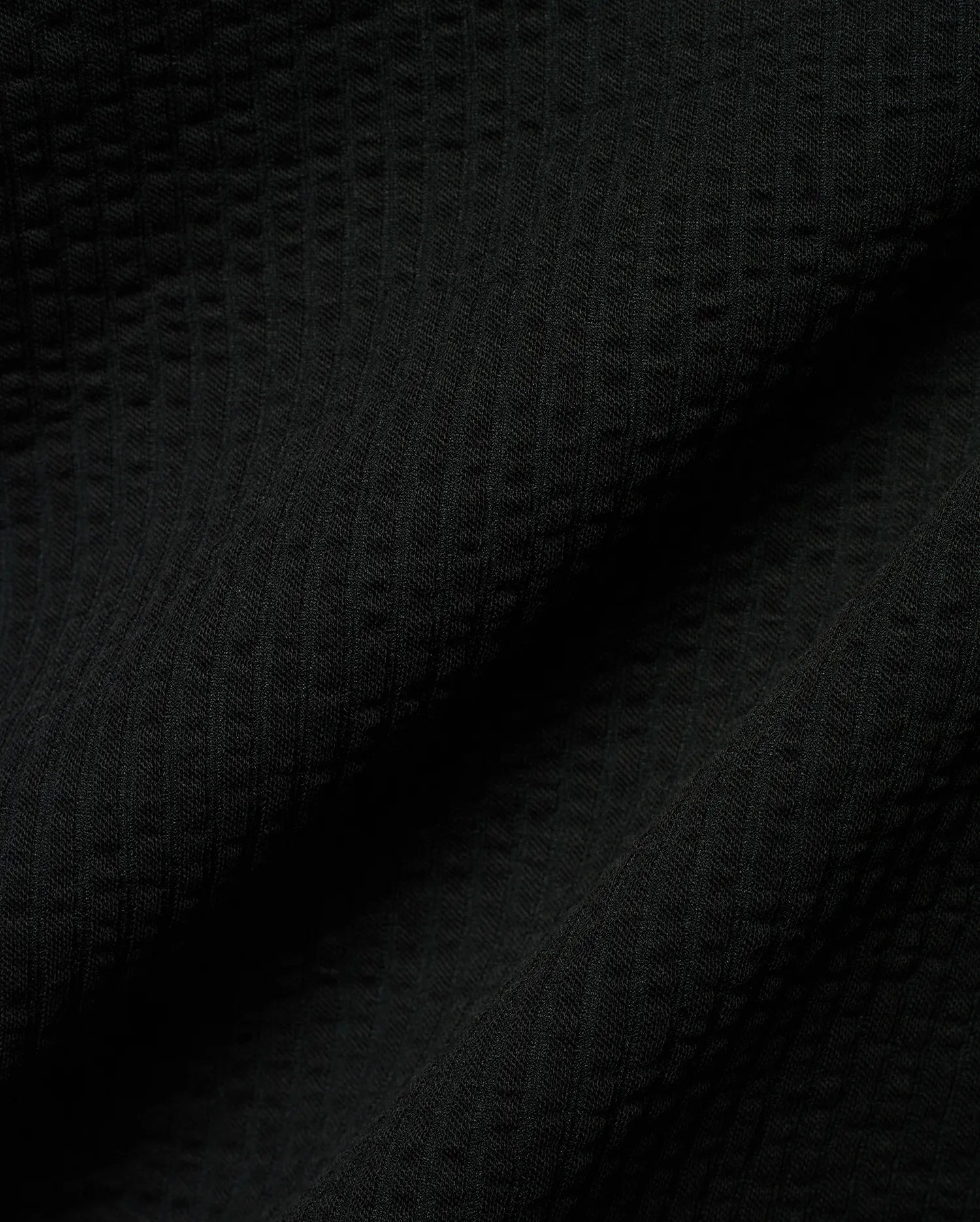 Mens Arlen Relaxed Seersucker Tee, a premium black tee crafted from a distinctive puckered seersucker fabric, offering a relaxed fit and refined streetwear aesthetic.