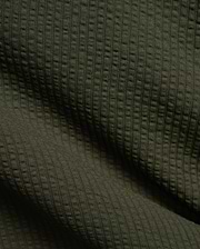 Mens Arlen Relaxed Seersucker Tee in deep olive green, showcasing its distinctive vertical puckered seersucker knit texture with subtle shadows.