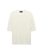 Mens Makai Textured Knit T-Shirt in cream, featuring a relaxed fit, subtle horizontal textured knit, and a small tonal embroidered Psycho Bunny skull logo on the left chest.