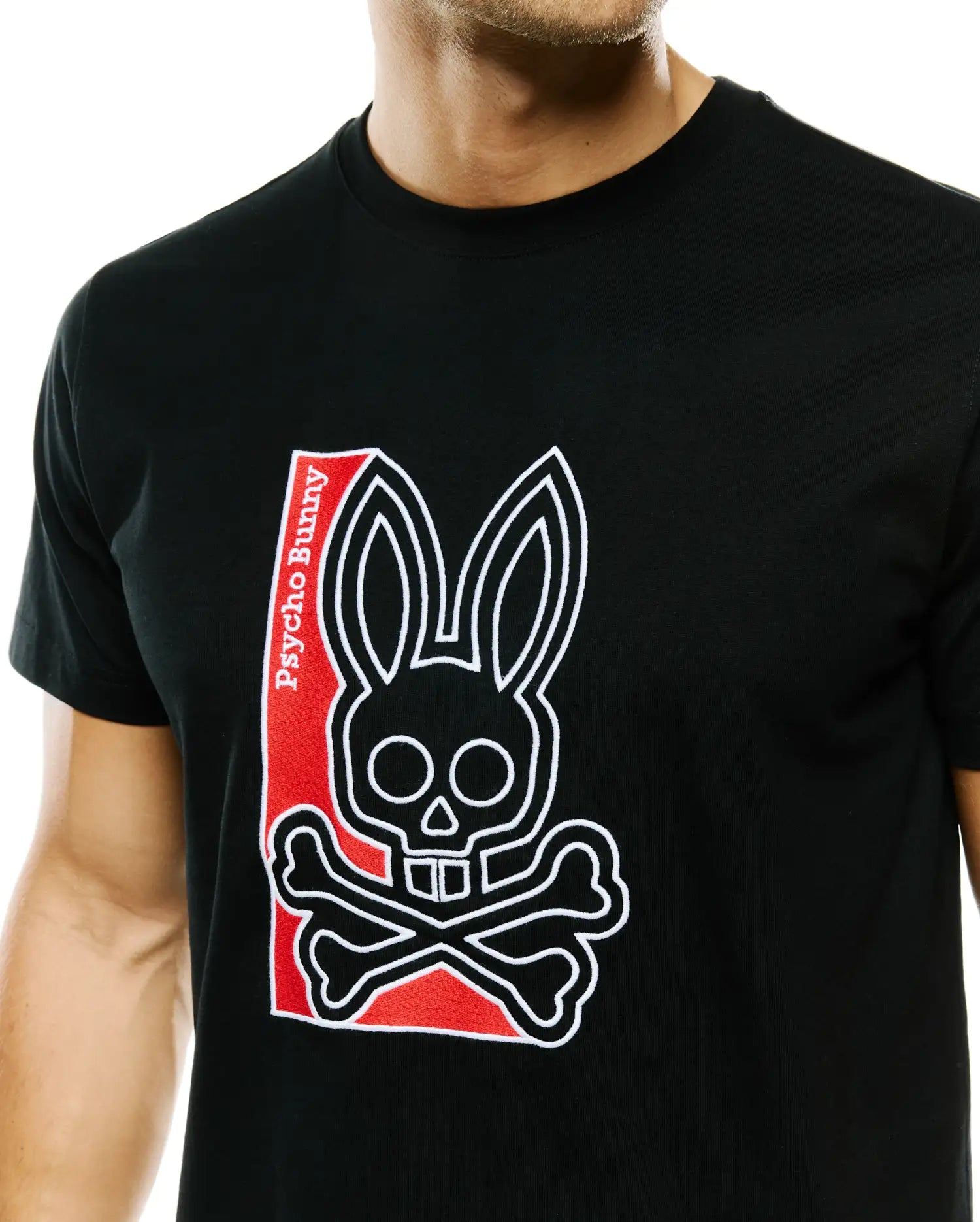 Men's Lowell Graphic Tee, black classic fit jersey t-shirt with a large white outlined Psycho Bunny skull and crossbones logo on the chest, featuring a red background and white Psycho Bunny text. (3)