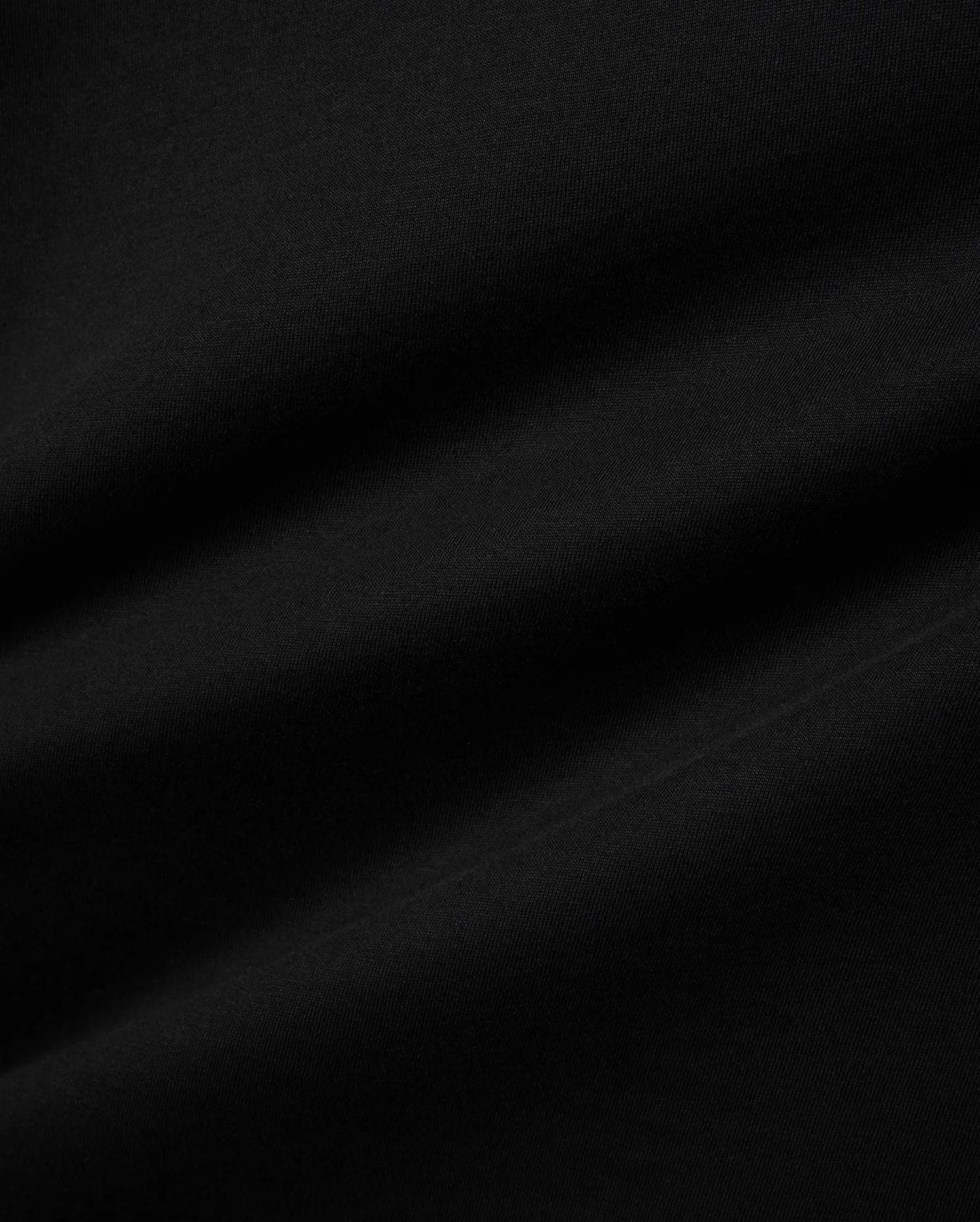 Premium black jersey Mens Miami Back Graphic Tee, showcasing a soft, smooth texture with subtle drapes, offering a refined streetwear aesthetic for versatile styling. (6)