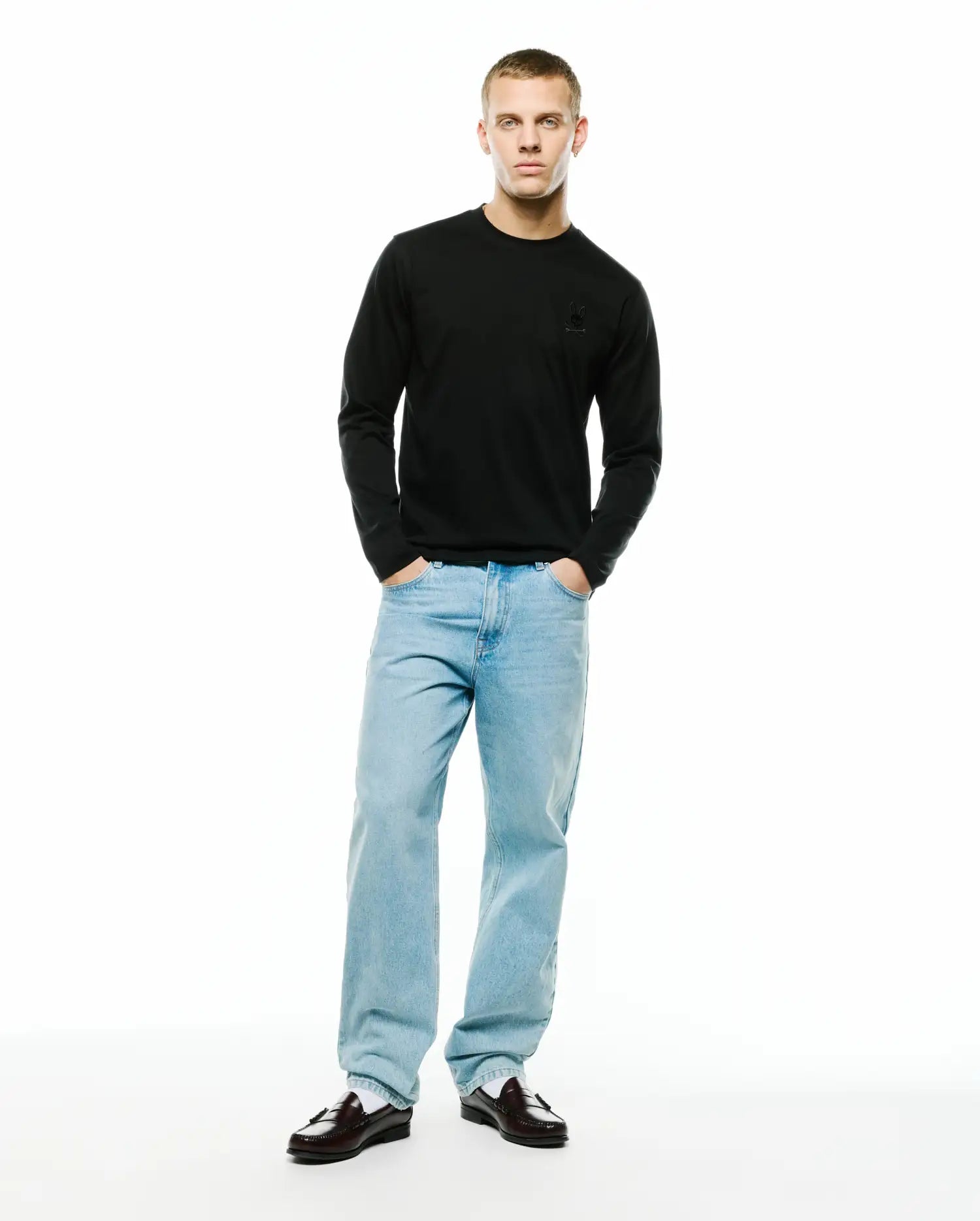 Men's Oscar Longsleeve Tee, a classic fit black jersey knit long-sleeve t-shirt featuring a small, tonal embroidered Psycho Bunny skull logo on the left chest. (4)