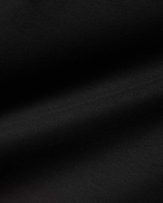 Men's Oscar Longsleeve Tee, a luxurious deep black jersey knit fabric, showcasing a smooth, soft texture with subtle, flowing folds, indicative of premium quality menswear. (6)