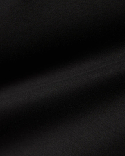 Men's Oscar Longsleeve Tee, a luxurious deep black jersey knit fabric, showcasing a smooth, soft texture with subtle, flowing folds, indicative of premium quality menswear. (6)