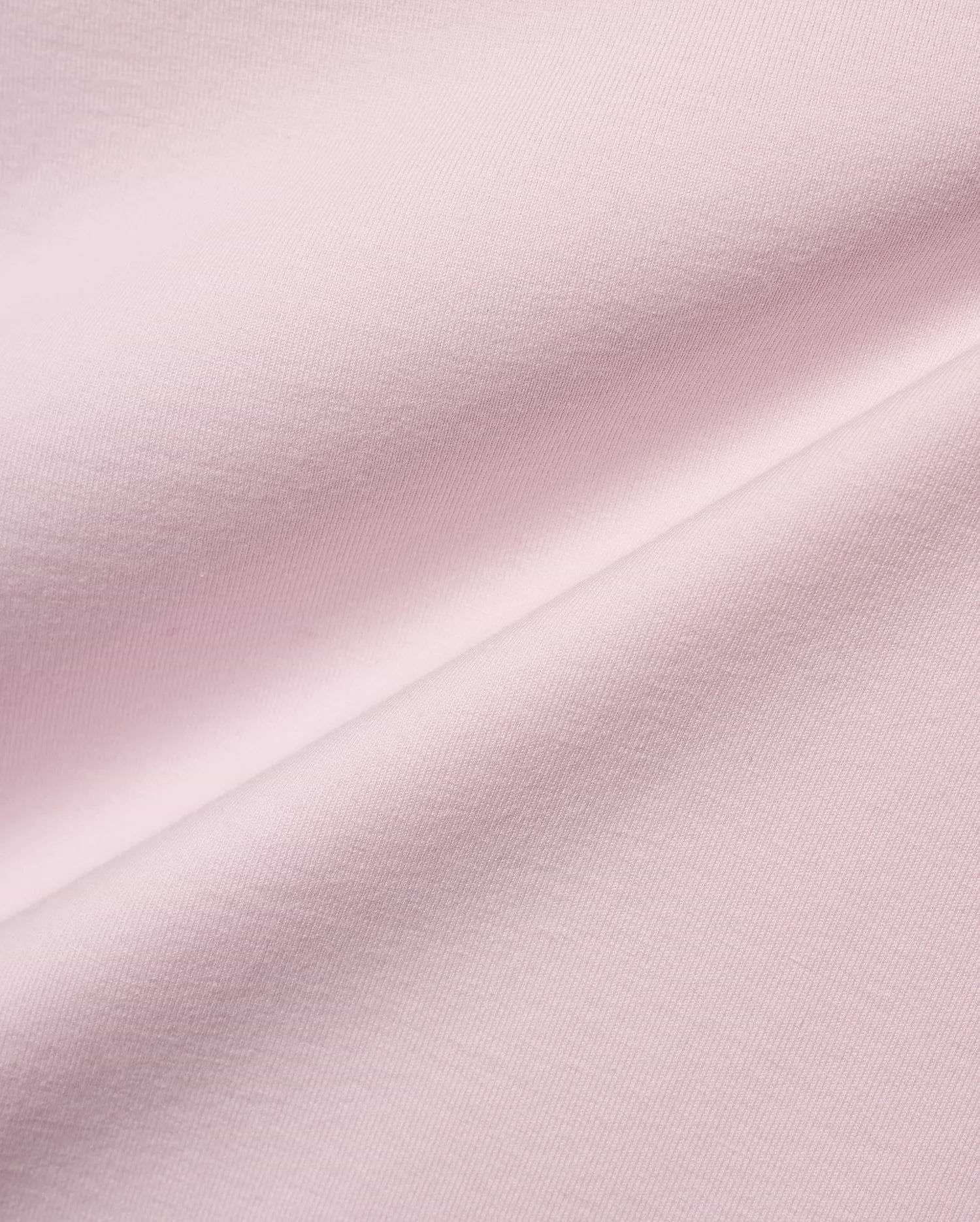 Men's Jim Jersey Longsleeve Shirt, a close-up of the premium light pink jersey knit fabric, showcasing its soft, smooth texture with subtle diagonal ribbing and elegant draping folds. (5)