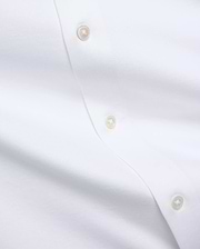 Premium white Jim Jersey Knit Shirt, showcasing a smooth jersey knit fabric and a refined button placket with three iridescent mother-of-pearl buttons. (6)