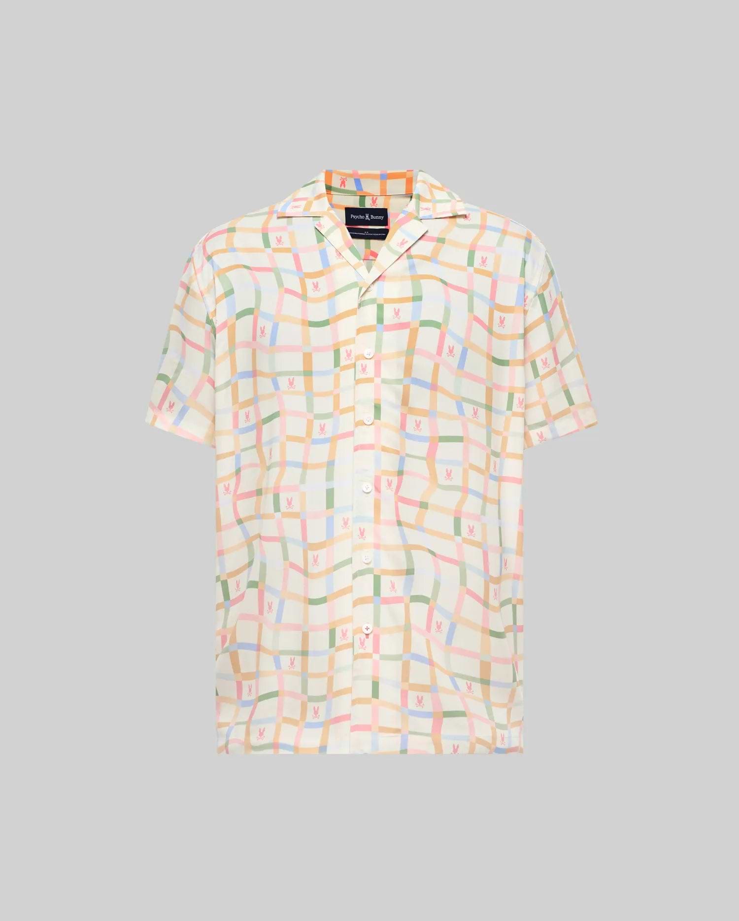 Mens Atlas Tencel Shirt, a relaxed fit short-sleeve shirt in off-white Tencel, featuring an all-over pastel grid pattern with subtle repeated Psycho Bunny skull logos and a camp collar.