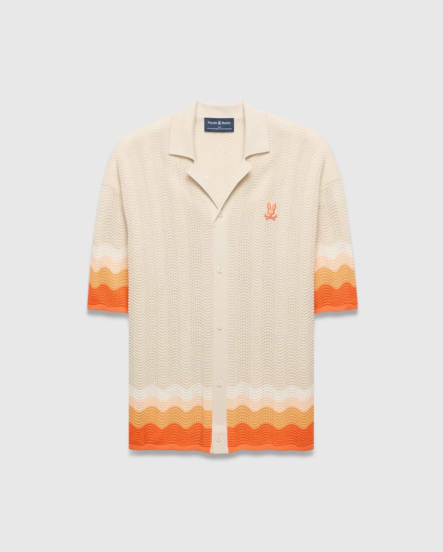 Cream Mens Holden Relaxed Fit Knit Shirt with a wavy texture, featuring an orange and peach ombre stripe on the sleeves and hem, and an embroidered orange Psycho Bunny skull logo on the left chest. (5)