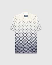 Mens Tobias Tencel Shirt, a relaxed fit cream short-sleeve camp collar shirt with a navy blue diamond pattern that intensifies downwards, featuring the iconic Psycho Bunny skull logo.