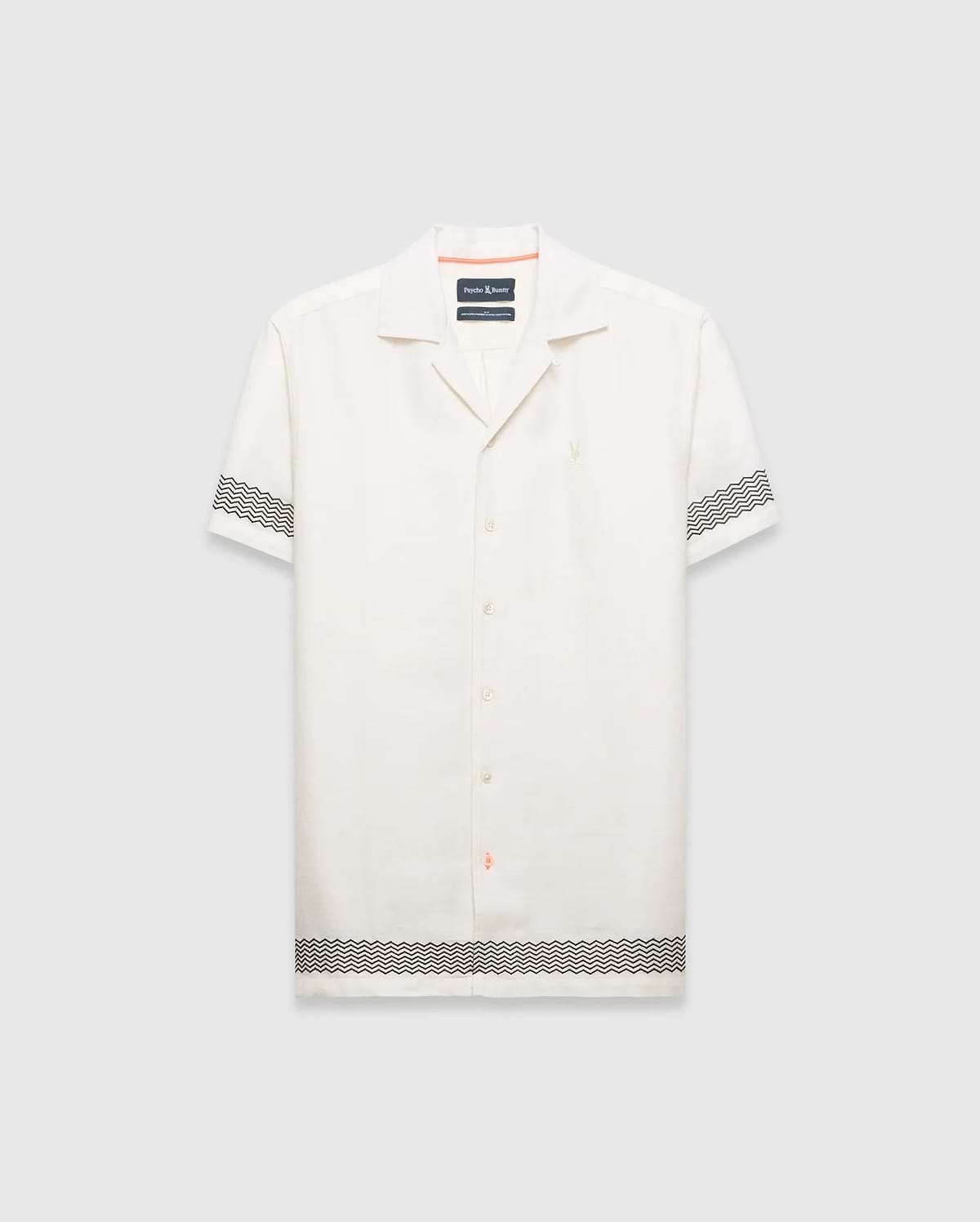 Mens Sunny Linen Shirt, an off-white relaxed linen camp collar shirt, features black zigzag patterns on sleeves and hem, an embroidered Psycho Bunny logo left chest, and orange collar trim. (5)