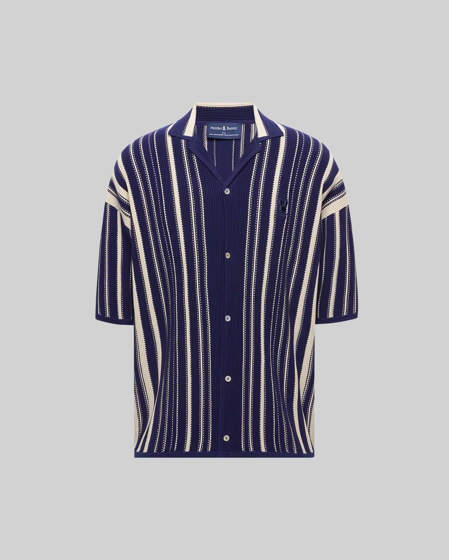 Mens Cliff Shirt, a navy blue and cream vertical striped ribbed knit short-sleeve shirt with a relaxed fit, spread collar, button-front, and small embroidered Psycho Bunny skull logo on the left chest.