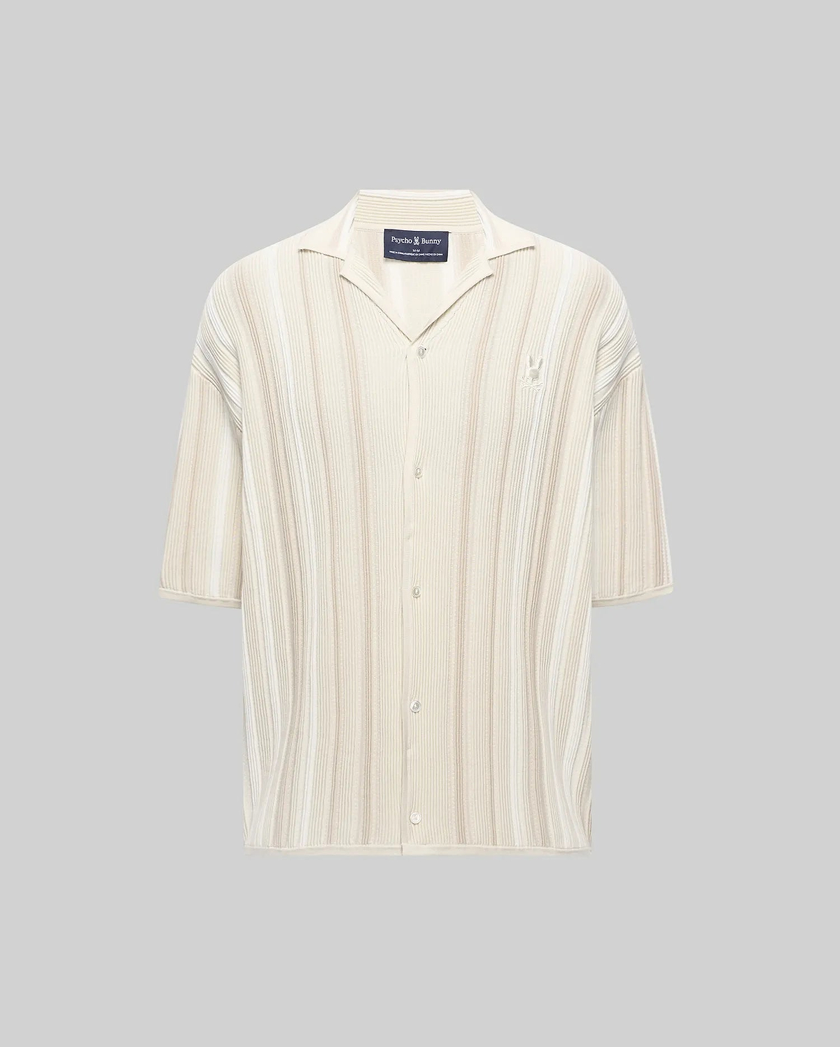 Mens Cliff Shirt, a relaxed fit cream and beige striped ribbed knit button-up with a camp collar, short sleeves, and a small embroidered Psycho Bunny skull logo on the left chest.