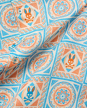 Mens Frank Tencel Shirt in cream with an all-over bright blue and orange mosaic tile pattern featuring repeated Psycho Bunny skull logos. (6)