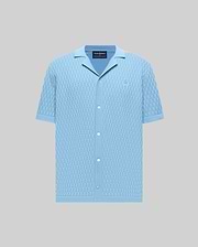 Mens Xandros Knit Shirt, light blue with a checkerboard knit pattern, featuring a spread collar, short sleeves, full button-front, and a small embroidered Psycho Bunny skull logo on the left chest.