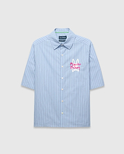 Mens Duncan Stripe Shirt, a light blue classic fit short-sleeve button-up shirt with thin dark blue vertical stripes and a large pink and white embroidered Psycho Bunny logo on the chest. (6)