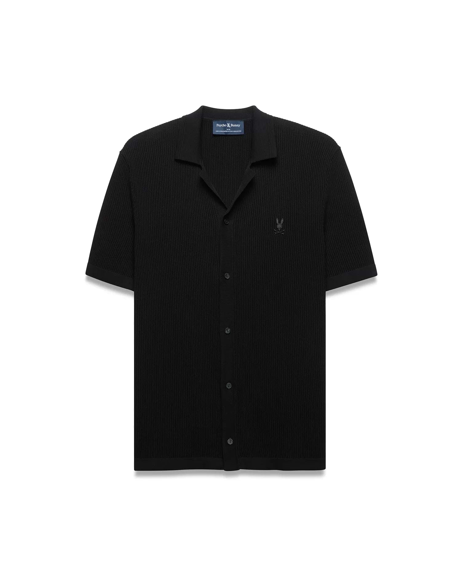 Black Mens Yann Knit Shirt with a classic fit, featuring a ribbed knit texture, full button-front, spread collar, short sleeves, and a small embroidered Psycho Bunny skull logo on the left chest.
