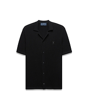 Black Mens Yann Knit Shirt with a classic fit, featuring a ribbed knit texture, full button-front, spread collar, short sleeves, and a small embroidered Psycho Bunny skull logo on the left chest.