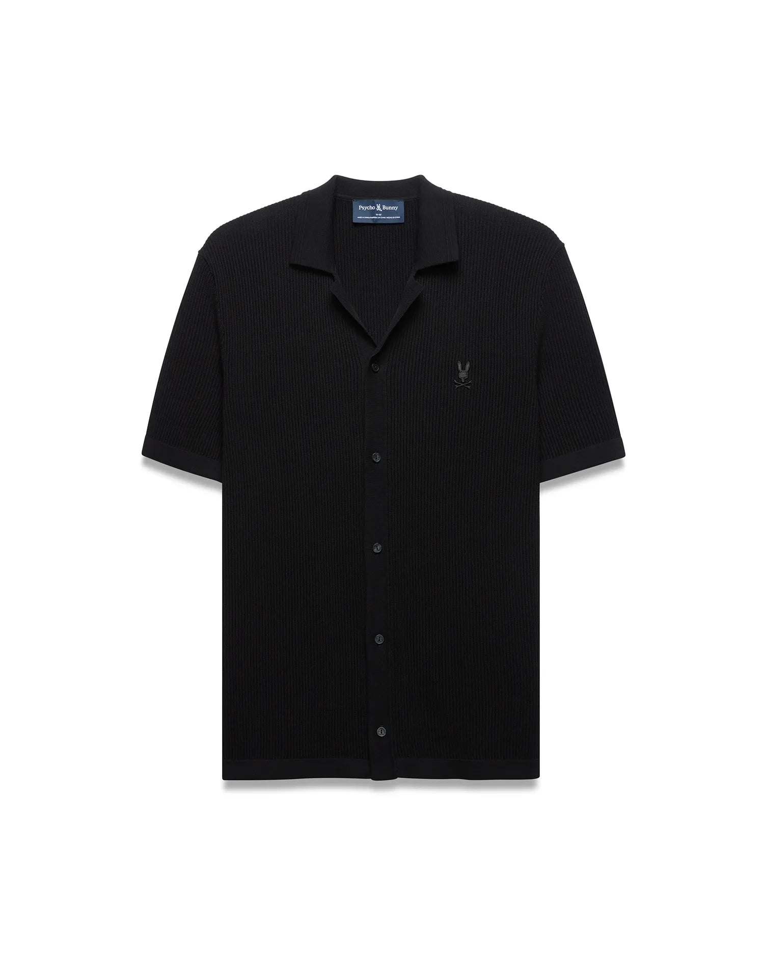 Black Mens Yann Knit Shirt with a classic fit, featuring a ribbed knit texture, full button-front, spread collar, short sleeves, and a small embroidered Psycho Bunny skull logo on the left chest.