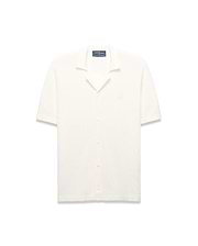 Mens Yann Knit Shirt, cream ribbed knit, short-sleeve, full button-front, camp collar, with a small embroidered Psycho Bunny skull logo on the left chest, classic fit.