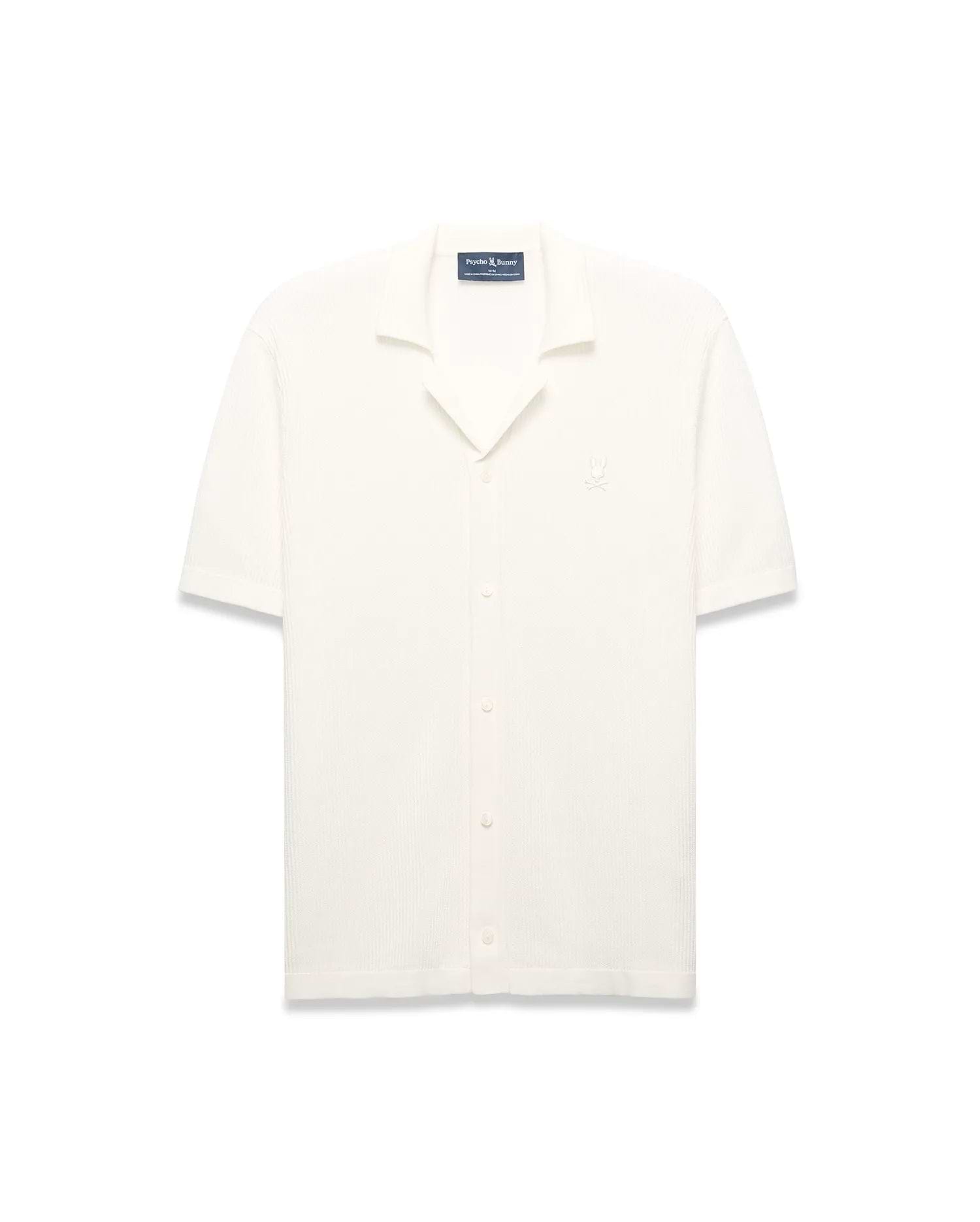 Mens Yann Knit Shirt, cream ribbed knit, short-sleeve, full button-front, camp collar, with a small embroidered Psycho Bunny skull logo on the left chest, classic fit.
