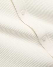 Mens Yann Knit Shirt by Psycho Bunny, a crisp white knit top with a subtle diagonal chevron pattern, featuring a clean button placket with translucent buttons.