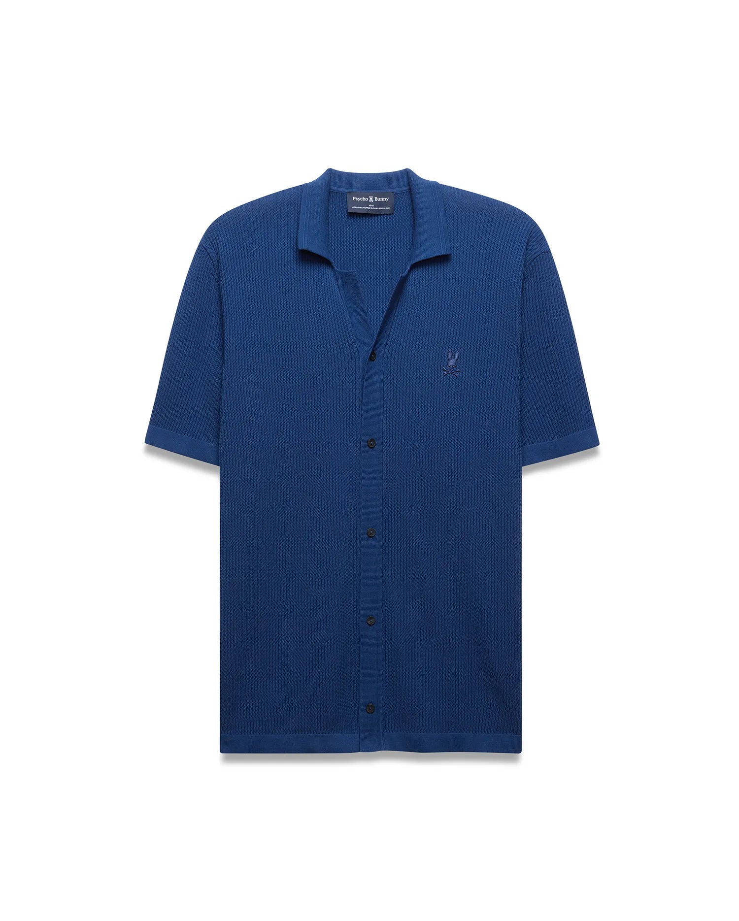 Mens Yann Knit Shirt in deep blue, featuring a ribbed knit texture, open collar, short sleeves, black button placket, and a small embroidered Psycho Bunny skull logo on the left chest.