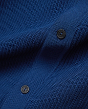 Mens Yann Knit Shirt in vibrant royal blue, featuring a premium, refined, subtly textured knit fabric and dark, branded Psycho Bunny buttons.