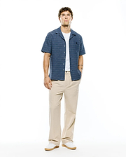 Mens Erik Raised Check Shirt: Relaxed fit navy blue short-sleeve camp collar shirt with light blue textured horizontal stripes, featuring a small embroidered Psycho Bunny skull logo on the left chest.