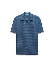 Mens Erik Raised Check Shirt. Relaxed fit short-sleeve blue camp collar shirt with a raised blue and grey check pattern, featuring a small embroidered Psycho Bunny skull logo on the left chest.
