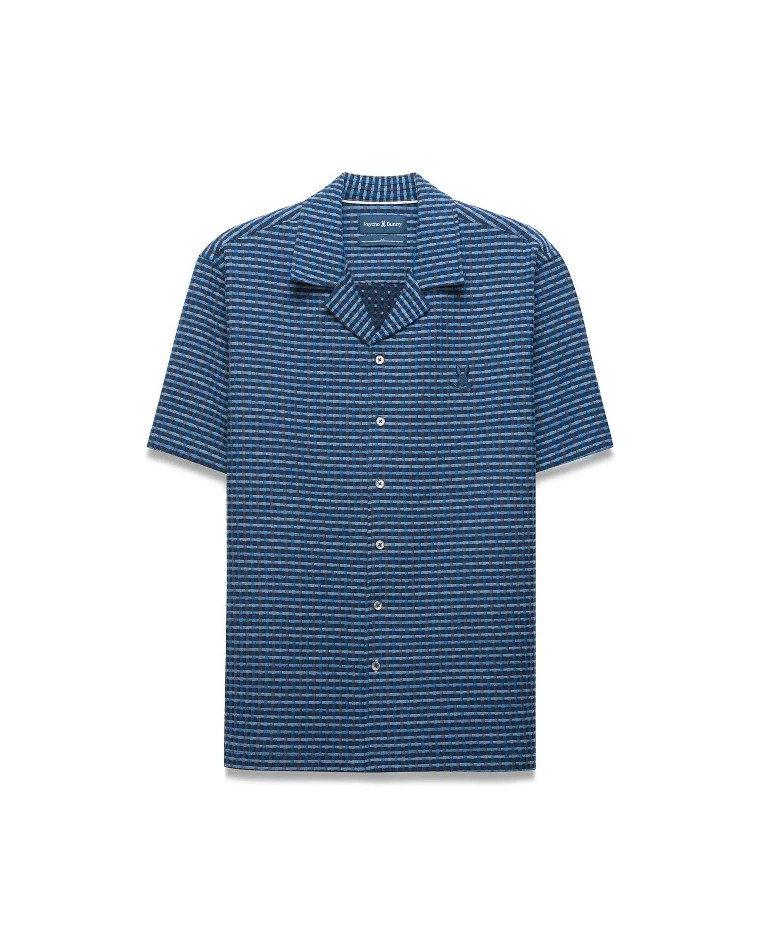 Mens Erik Raised Check Shirt. Relaxed fit short-sleeve blue camp collar shirt with a raised blue and grey check pattern, featuring a small embroidered Psycho Bunny skull logo on the left chest.