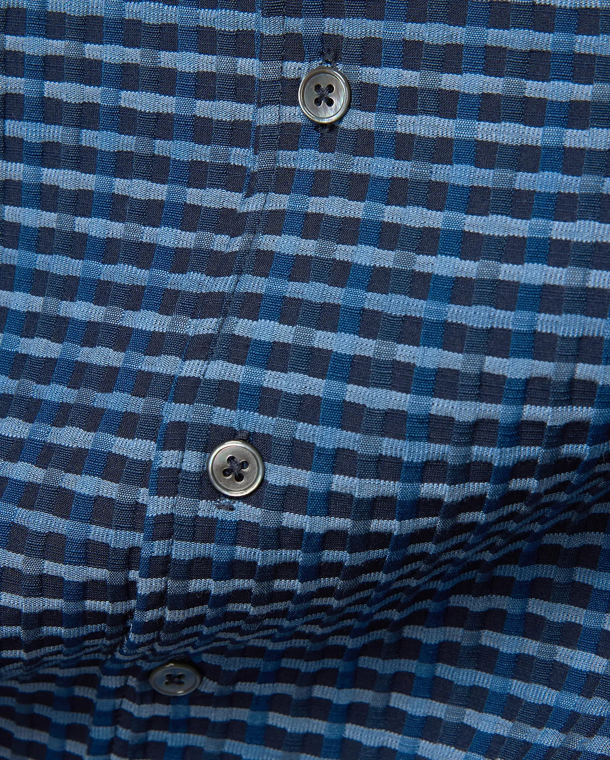 MENS Erik Raised Check Shirt, a premium blue and navy textured woven shirt featuring a distinctive raised check pattern with subtle puckering and dark grey buttons.