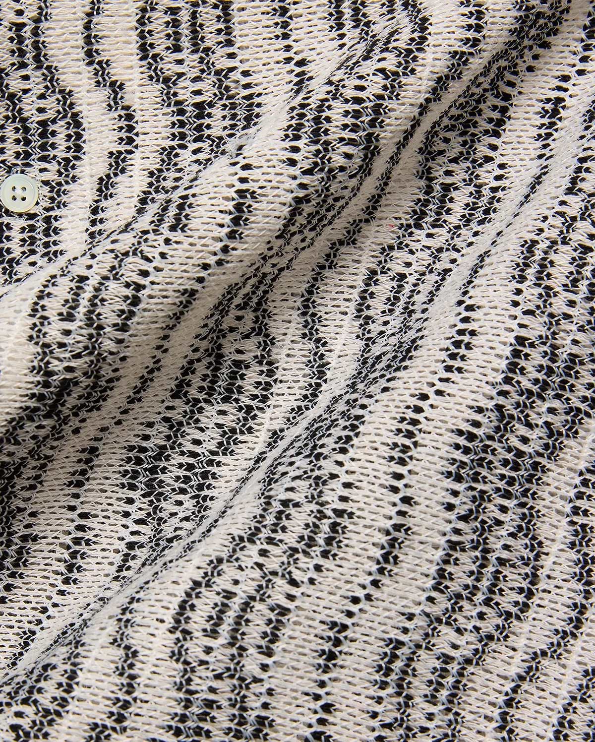 Mens Dave Crochet Shirt, a premium knit featuring an intricate cream and black open-weave texture with a distinctive zig-zag striped pattern and a visible light button closure. (5)