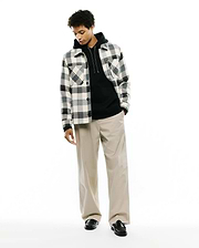 Mens Kessler Relaxed Plaid Overshirt in cream, black, and grey, featuring a soft, brushed texture, button-front, and two chest flap pockets, layered over a black hoodie.
