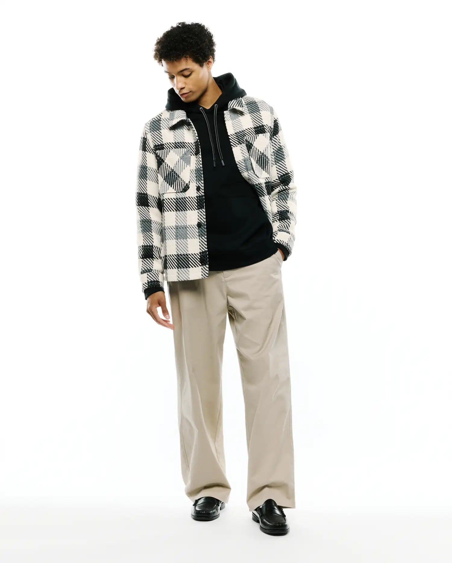 Mens Kessler Relaxed Plaid Overshirt in cream, black, and grey, featuring a soft, brushed texture, button-front, and two chest flap pockets, layered over a black hoodie.