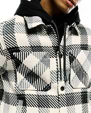 Mens Kessler Relaxed Plaid Overshirt in cream, black, and grey, featuring a relaxed fit, textured woven plaid fabric, two button-flap chest pockets, and a small Psycho Bunny tag on the layered hoodie's drawstring.