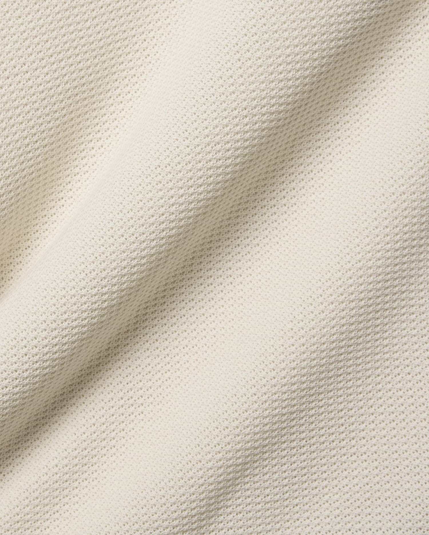 Mens Peter Knit Vest in ecru, a premium textured knit fabric with a soft handfeel and a subtle, repeating micro-waffle pattern, ideal for refined streetwear.