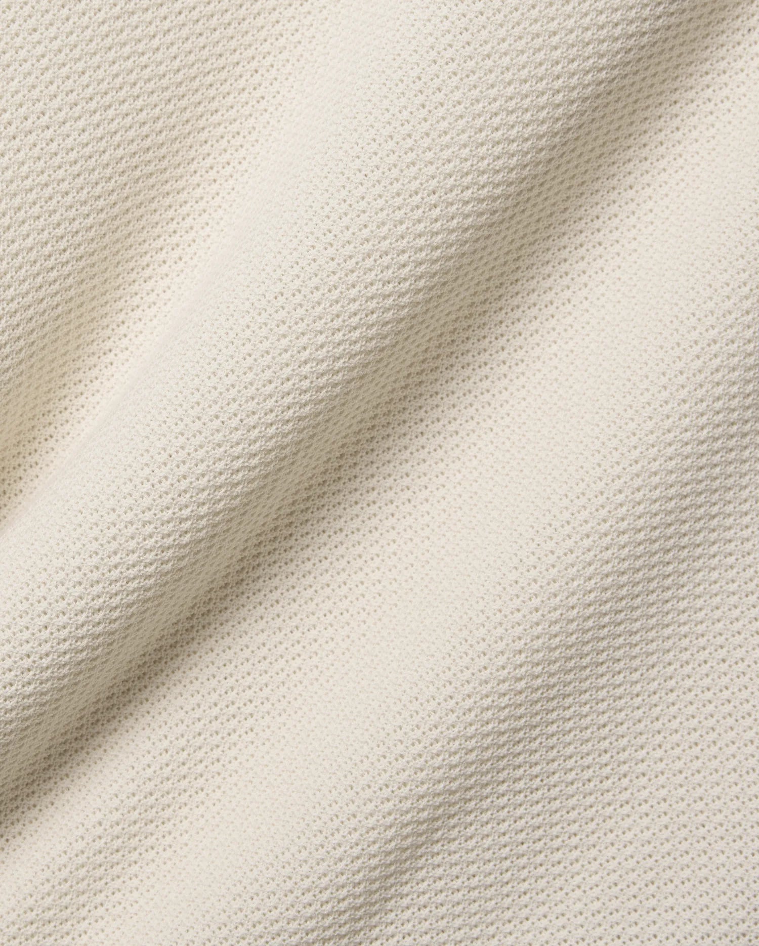 Mens Peter Knit Vest in ecru, a premium textured knit fabric with a soft handfeel and a subtle, repeating micro-waffle pattern, ideal for refined streetwear.