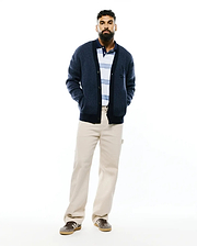 Mens Atkinson Cardigan, a navy blue relaxed fit waffle knit cardigan with a button-front, ribbed trim, two front pockets, and a small embroidered Psycho Bunny skull logo on the left chest.