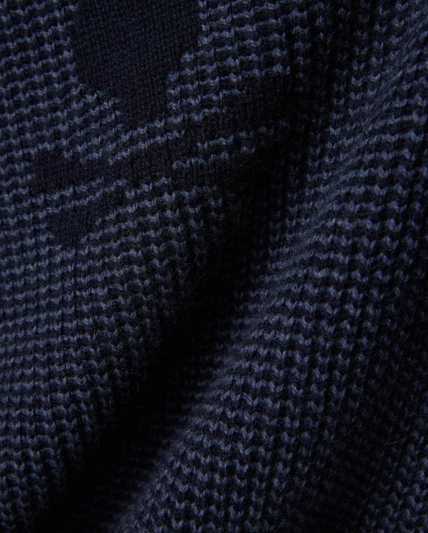 Mens Atkinson Cardigan, a dark navy blue chunky knit cardigan featuring a subtle, textured geometric pattern in lighter blue, crafted from a soft, premium knit fabric.