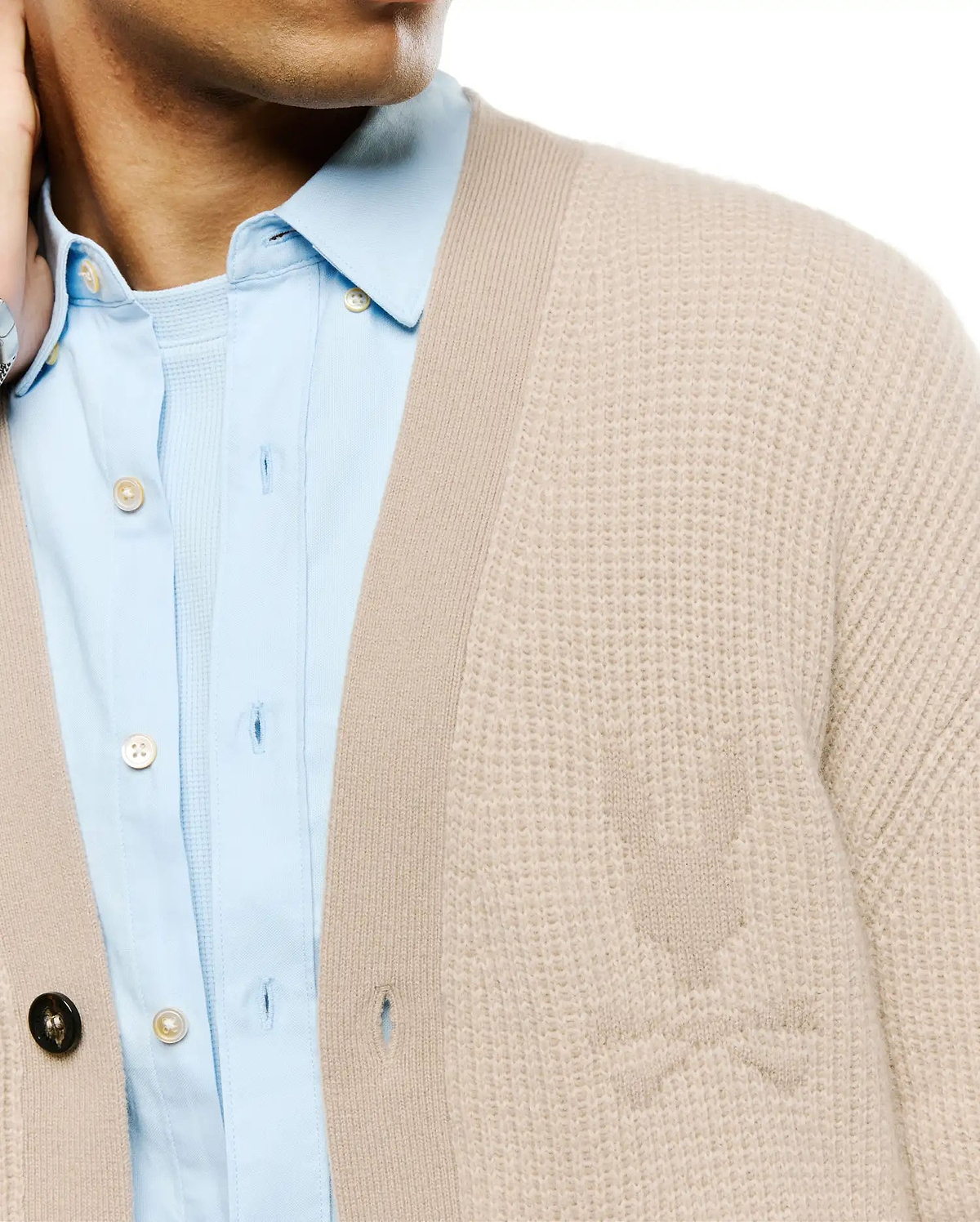 Mens Atkinson Cardigan, a beige textured knit cardigan with a classic fit, featuring a subtle tone-on-tone knitted Psycho Bunny skull logo on the left chest and a ribbed placket.