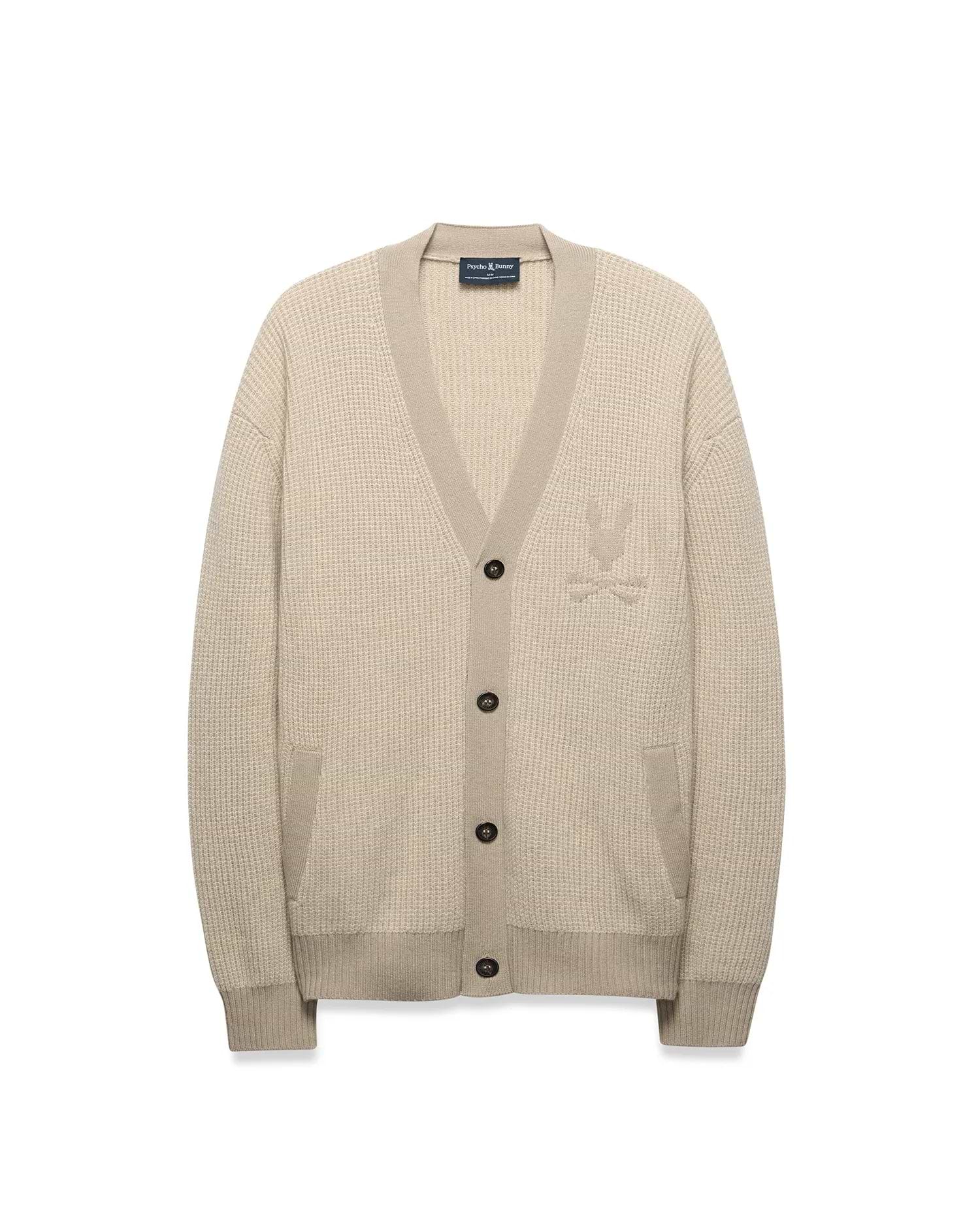 Mens Atkinson Cardigan in beige waffle knit, relaxed fit, with V-neck, dark buttons, front patch pockets, and a tone-on-tone embroidered Psycho Bunny skull logo on the left chest.