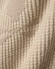 Psycho Bunny Mens Atkinson Cardigan, a luxurious beige knit featuring a subtle cream two-tone patterned texture and soft, visible knit stitches for refined streetwear style.